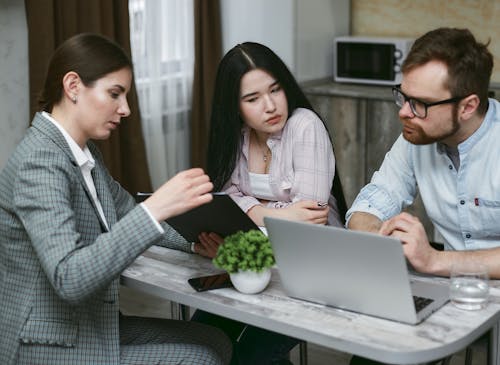 Free Group of People Discussing Notes Together Stock Photo