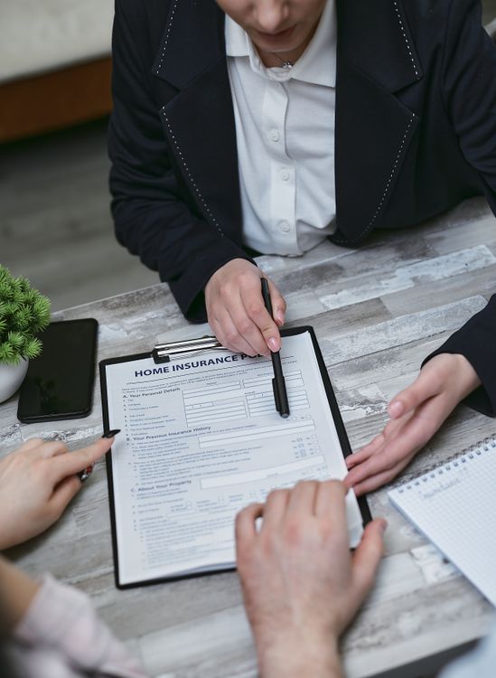 Person Presenting Paperwork · Free Stock Photo