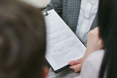 Close-up of professionals discussing a legal contract during a business meeting.
