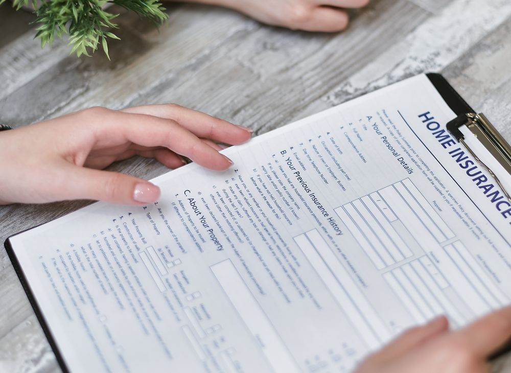 Homeowner reviewing an insurance claim form