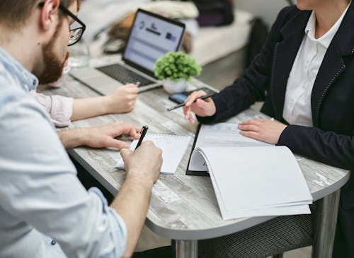 Man and Woman Working at an Office Desk