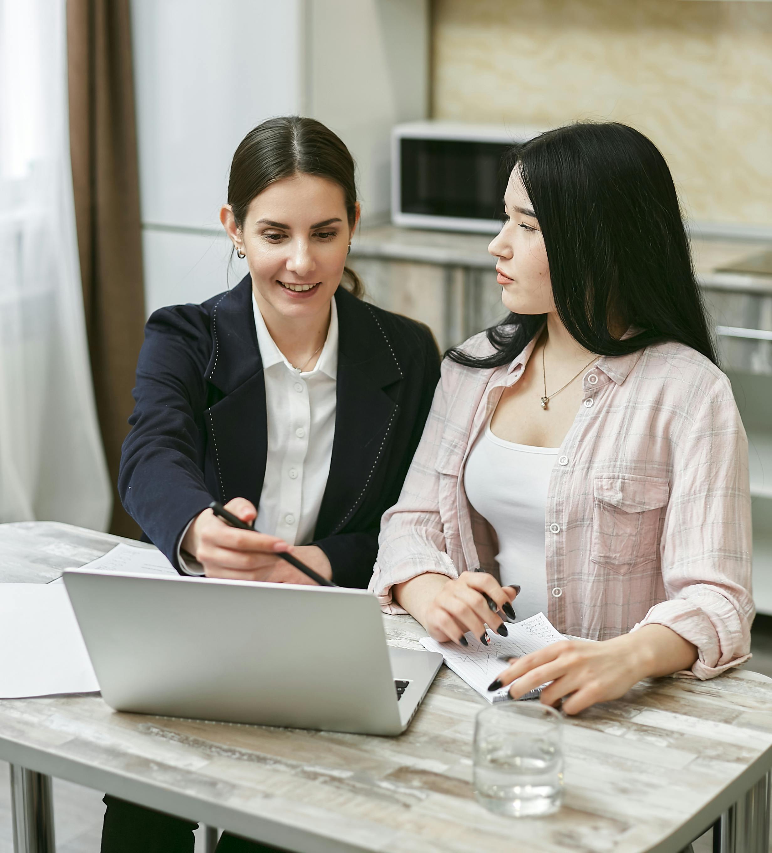 Two Women Working Together · Free Stock Photo