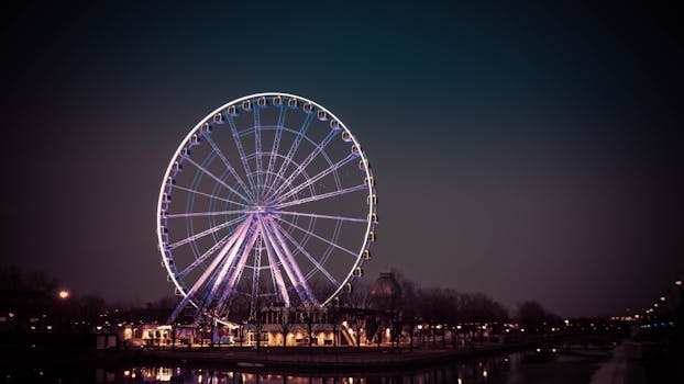 Stunning evening view of the illuminated Ferris wheel in Montreal, Canada at night.