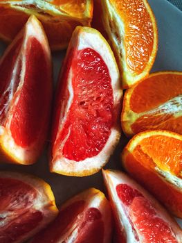 Close-up of juicy grapefruit and orange slices highlighting vibrant colors and texture.