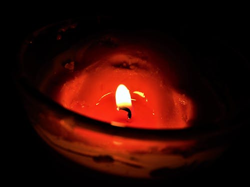 Free stock photo of burning candle, burning flame, candle burning in a dark room Stock Photo