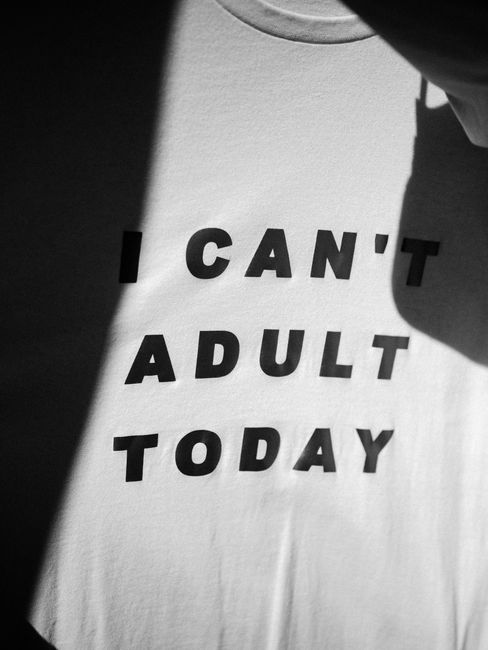 Black and white t-shirt with text "I Can't Adult Today" in a minimalist style.
