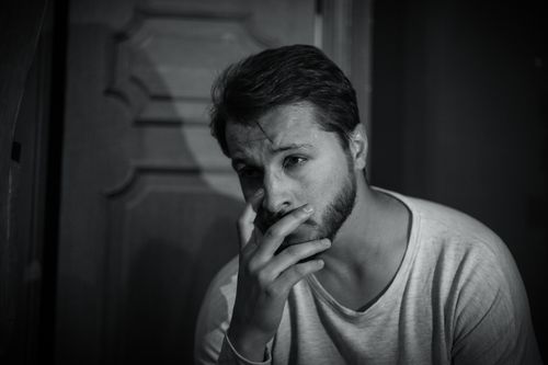 Free Thoughtful bearded man in grayscale, conveying emotion and solitude. Stock Photo