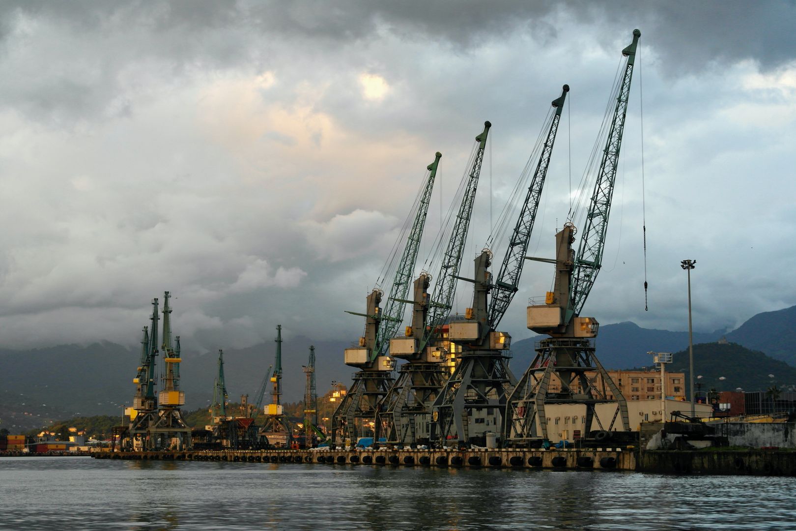 Heavy crane lifting industrial cargo at an Euro Gulf Logistics site