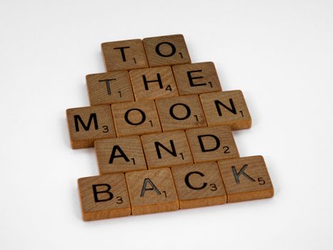 Brown Wooden Scrabble Tiles on a White Surface