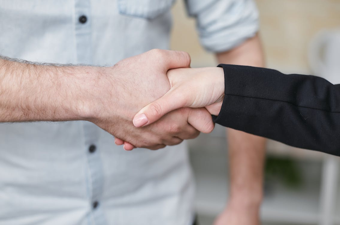 Free Two People Shaking their Hands  Stock Photo