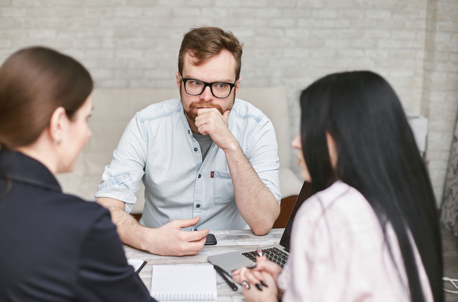 A focused client meeting — reading the signals before they become exits