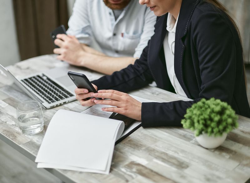 Two professionals collaborating in a business meeting