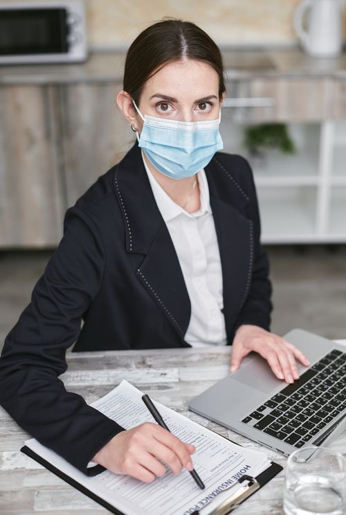 Woman in Black Suit Holding White Printer Paper · Free Stock Photo