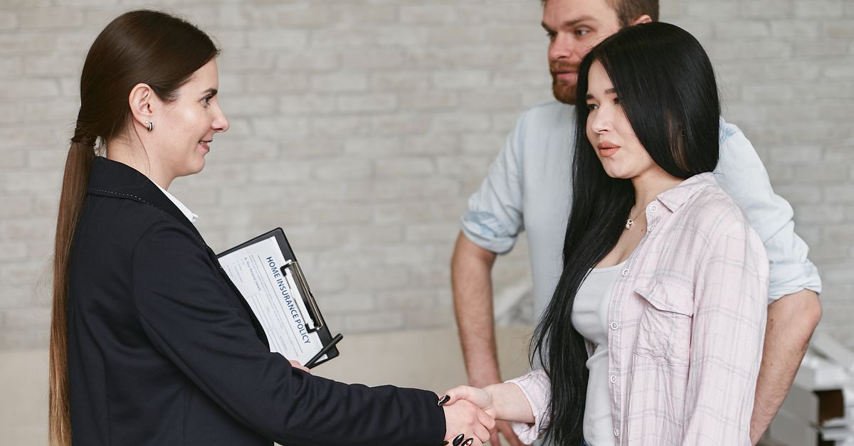 Woman talking with clients during a real coaching-style meeting