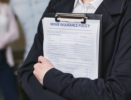 Free Person Holding Insurance Policy Contract Stock Photo