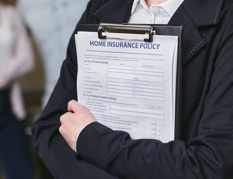 Person holding insurance policy contract - insurance claim paperwork