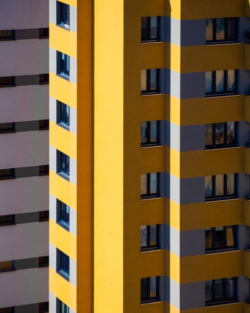 Free Vertical shot of modern buildings with vibrant colors in Berlin, Germany. Stock Photo