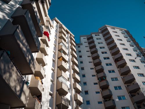 Free Low-angle view of modern residential apartment buildings in Berlin under clear sky. Stock Photo