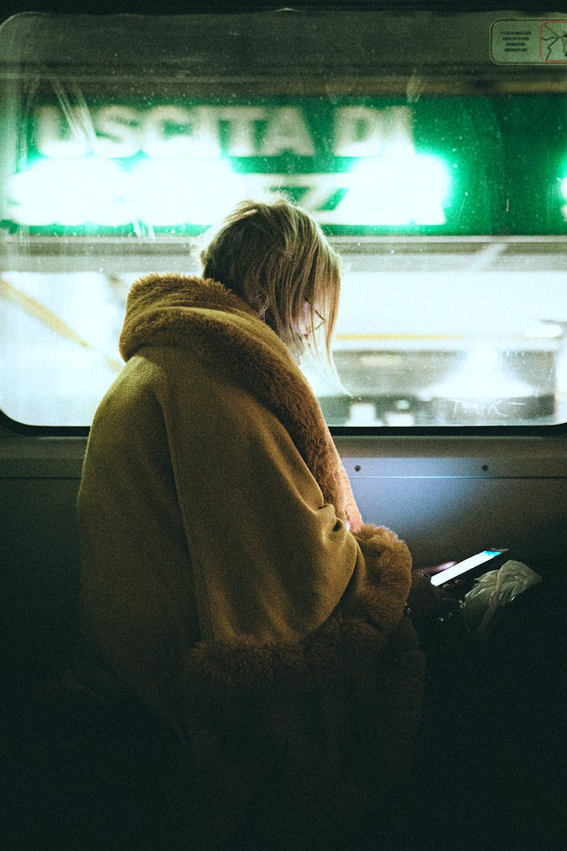 Anonymous woman sitting on train