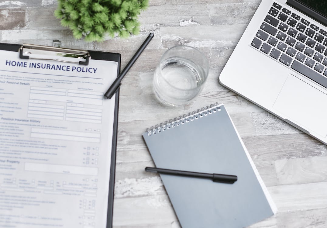 Image of insurance policy contract on a table.