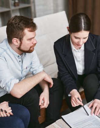 Accountant and client reviewing financial documents