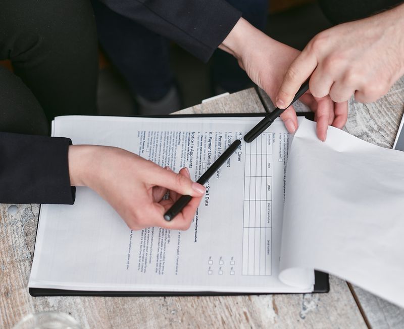 a small business owner reviewing AI policy documents