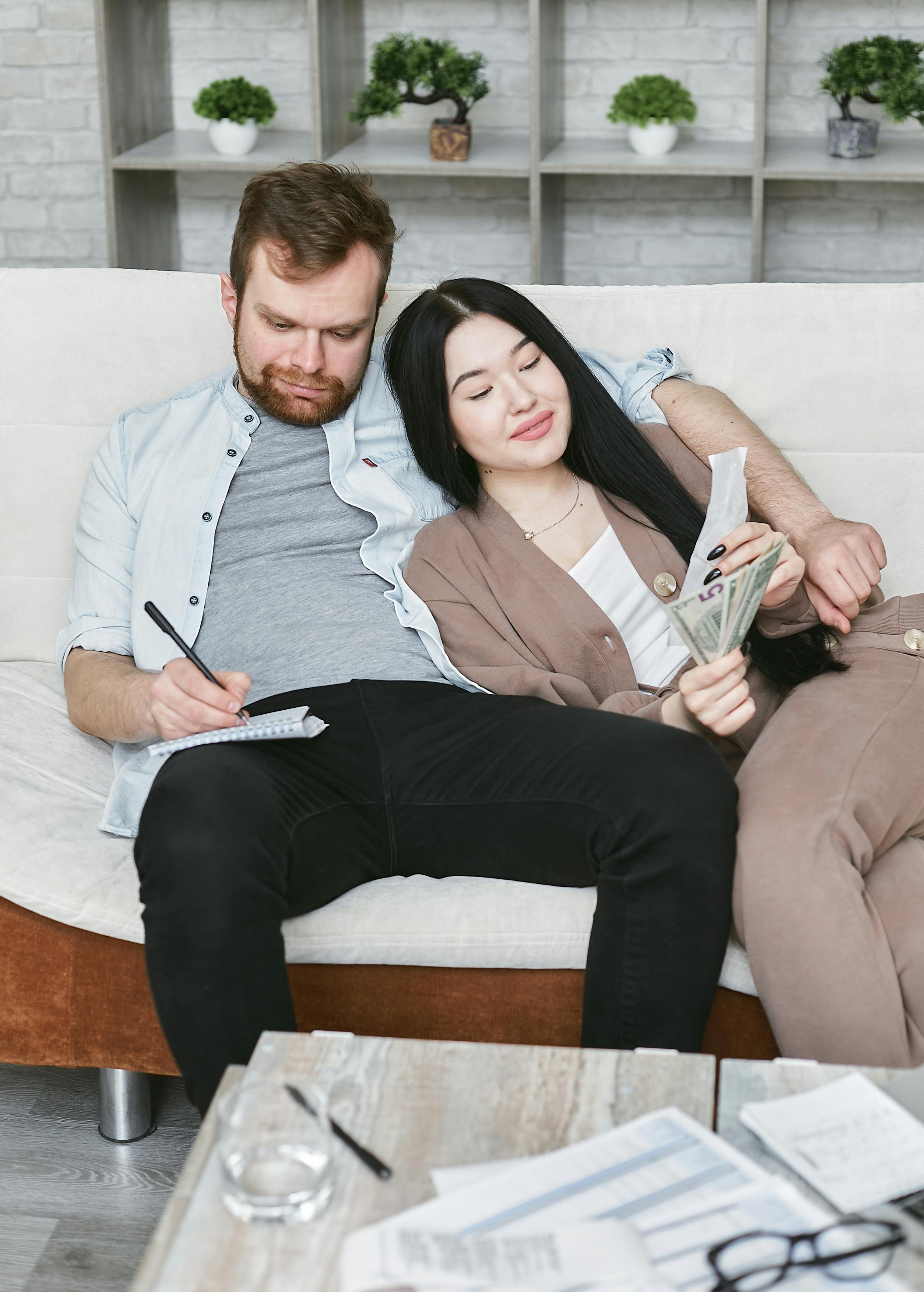 a couple sitting on a couch