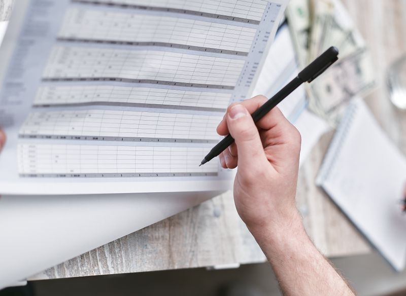Person reviewing a financial document