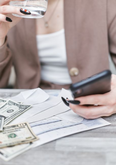 A person reviewing a financial spreadsheet on a tablet, spotting patterns in their account breakdown by type