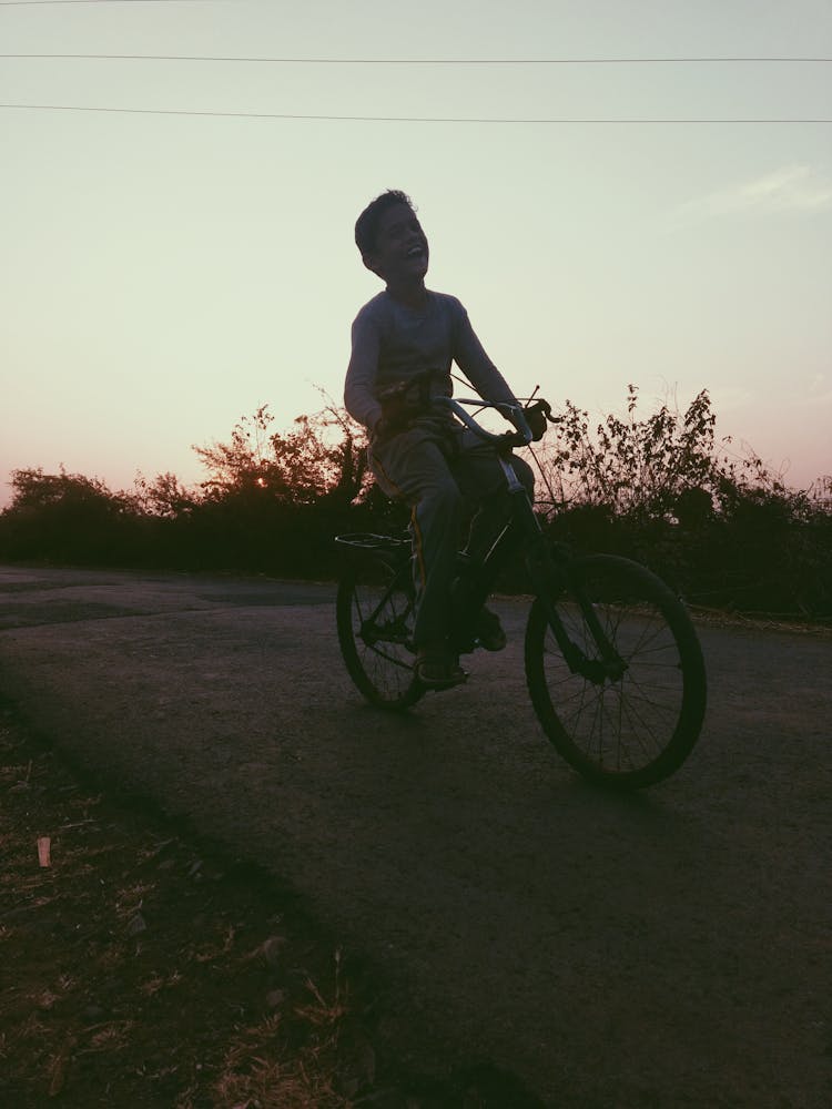 Boy Riding Of Bicycle