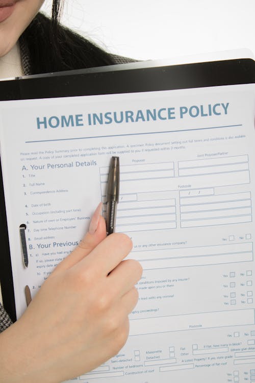 Free Person Holding Home Insurance Policy Stock Photo