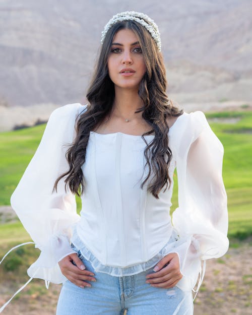 A Woman Wearing a White Blouse with Puffed Sleeves