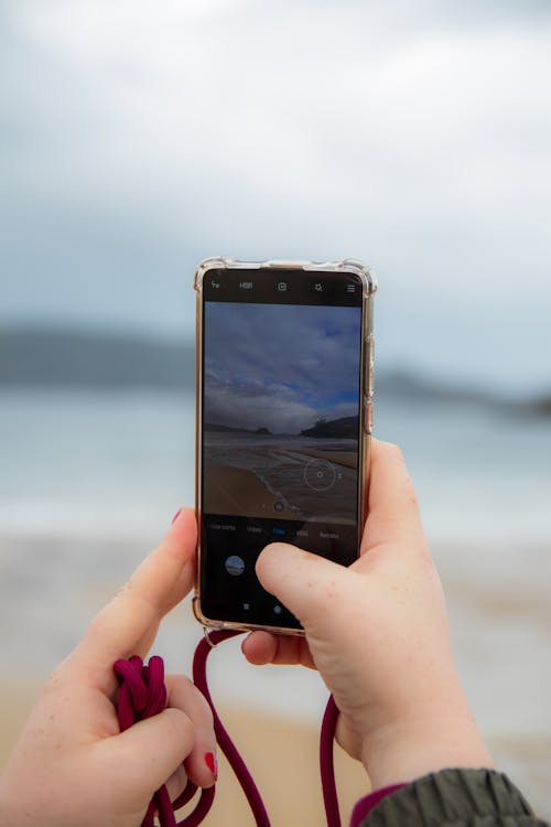 Close-Up Shot of a Person Taking Photo Using a Smartphone