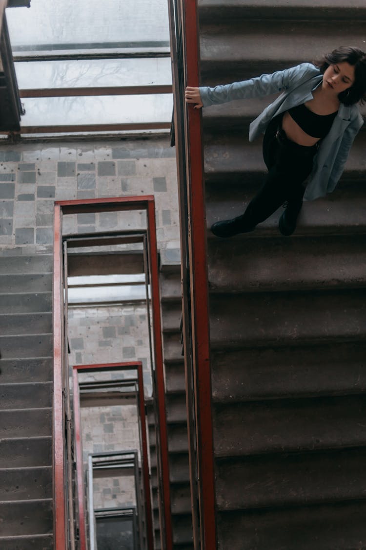 Top View Of A Woman Standing On The Stairs