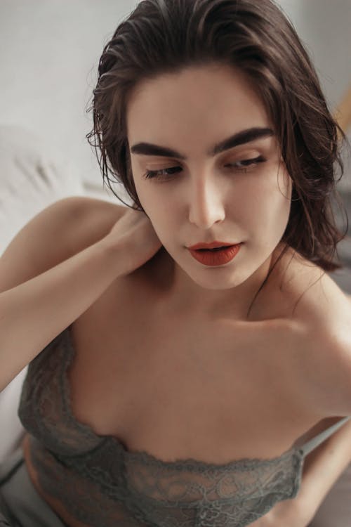 A Woman with Red Lips Wearing a Lingerie