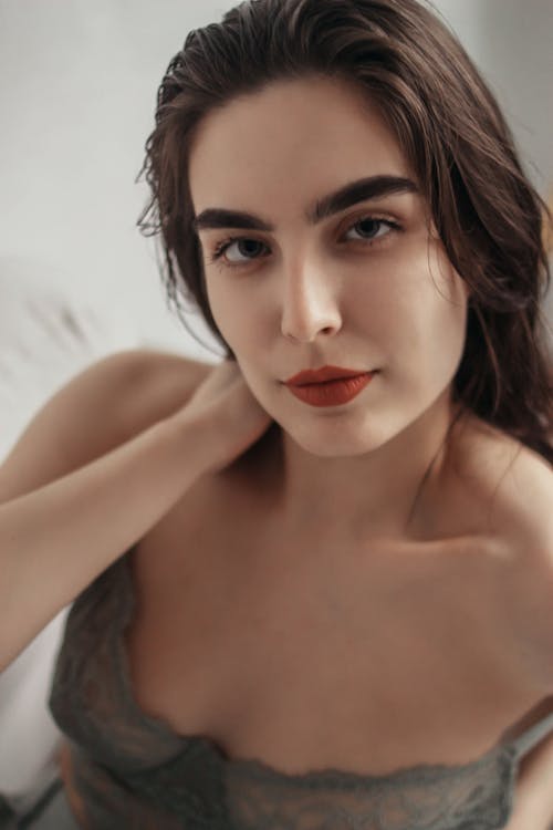 A Woman with Red Lips Wearing a Lingerie