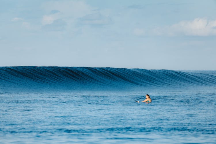 Person In Water With Rolling Waves