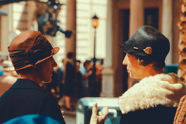 Women With Hats Talking