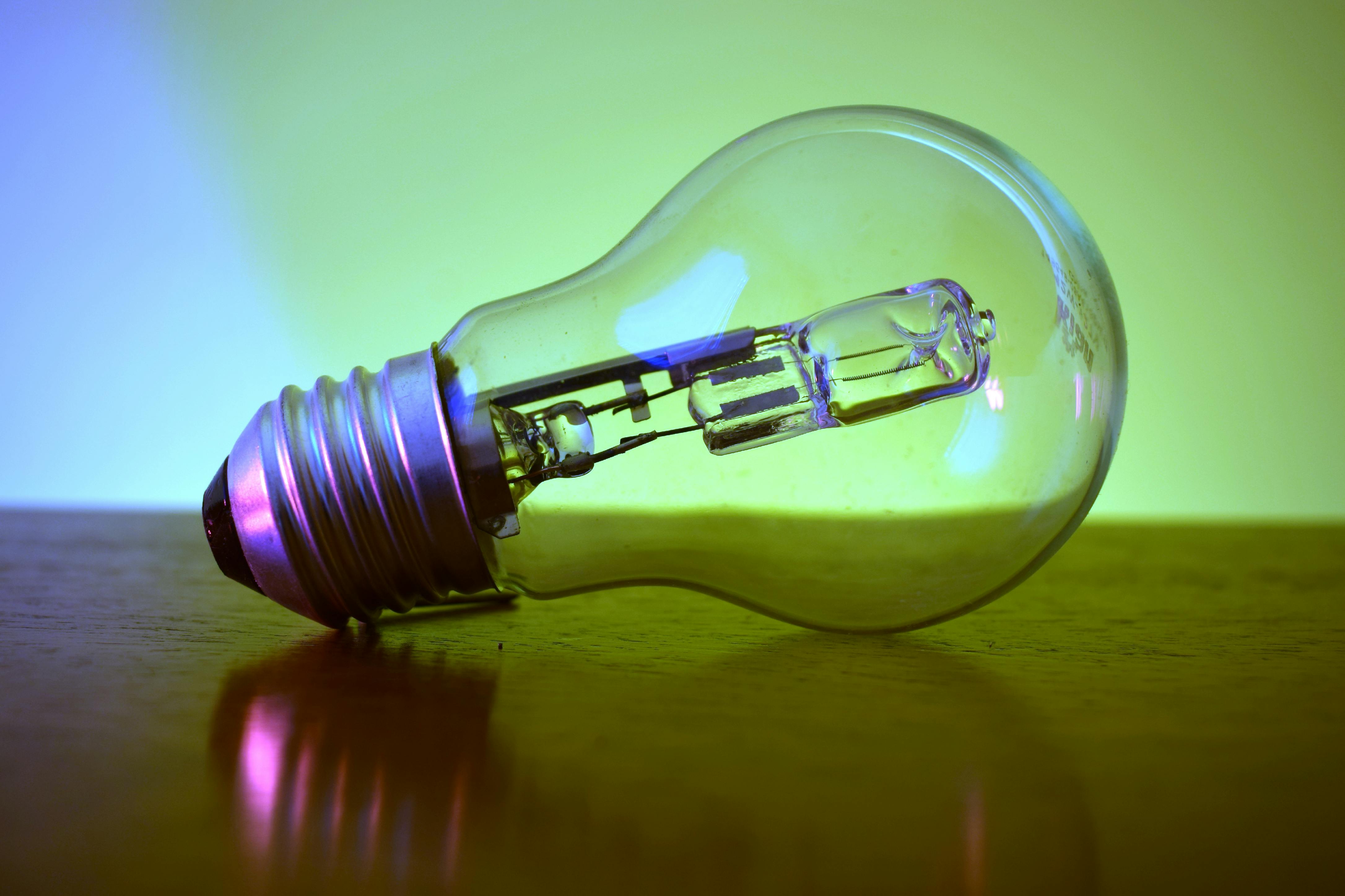 Light Bulb on Brown Wooden Table · Free Stock Photo