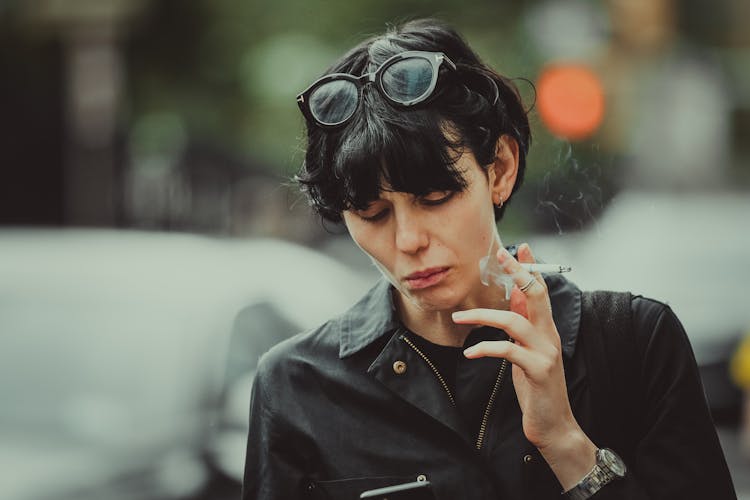 Woman In Black Leather Jacket Smoking 