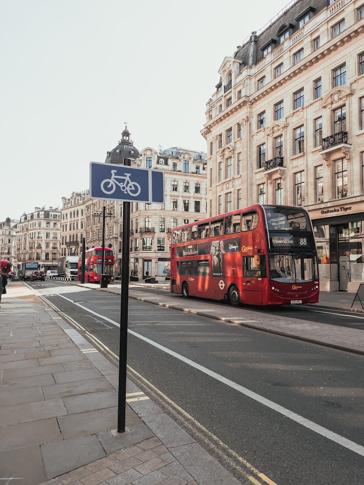 Red Double Decker Bus On Concrete Road