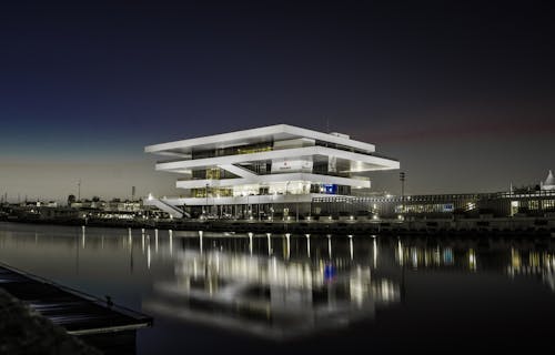 Photography of Multi-storey Building Near Body of Water