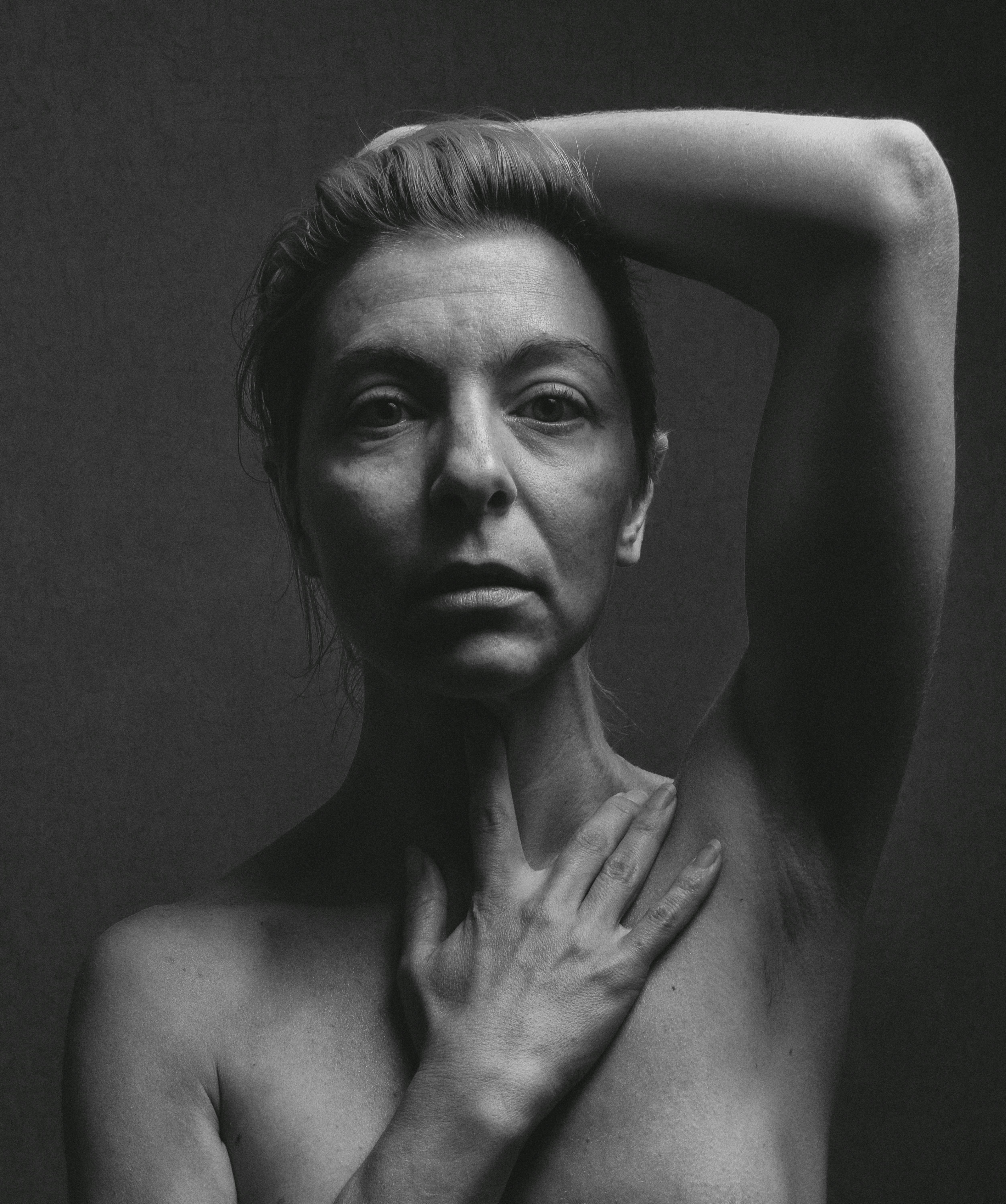 Grayscale Photo of a Topless Woman Posing at The Camera · Free Stock Photo