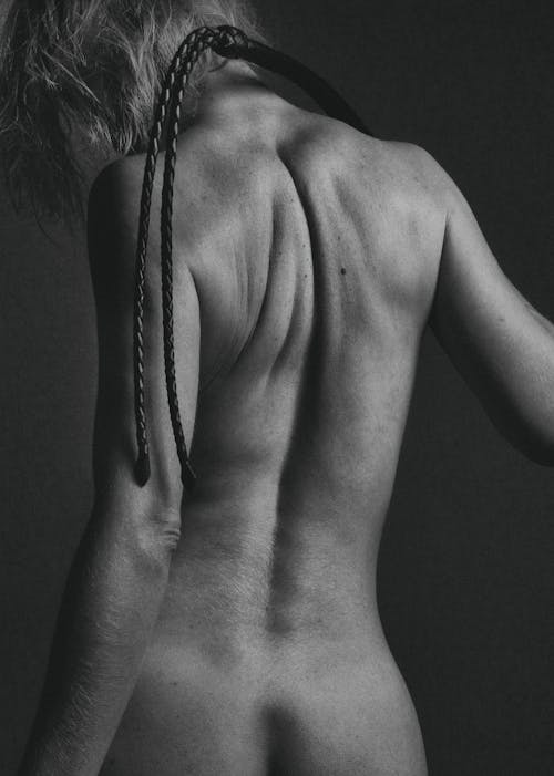 Back View Of Naked Woman In Grayscale