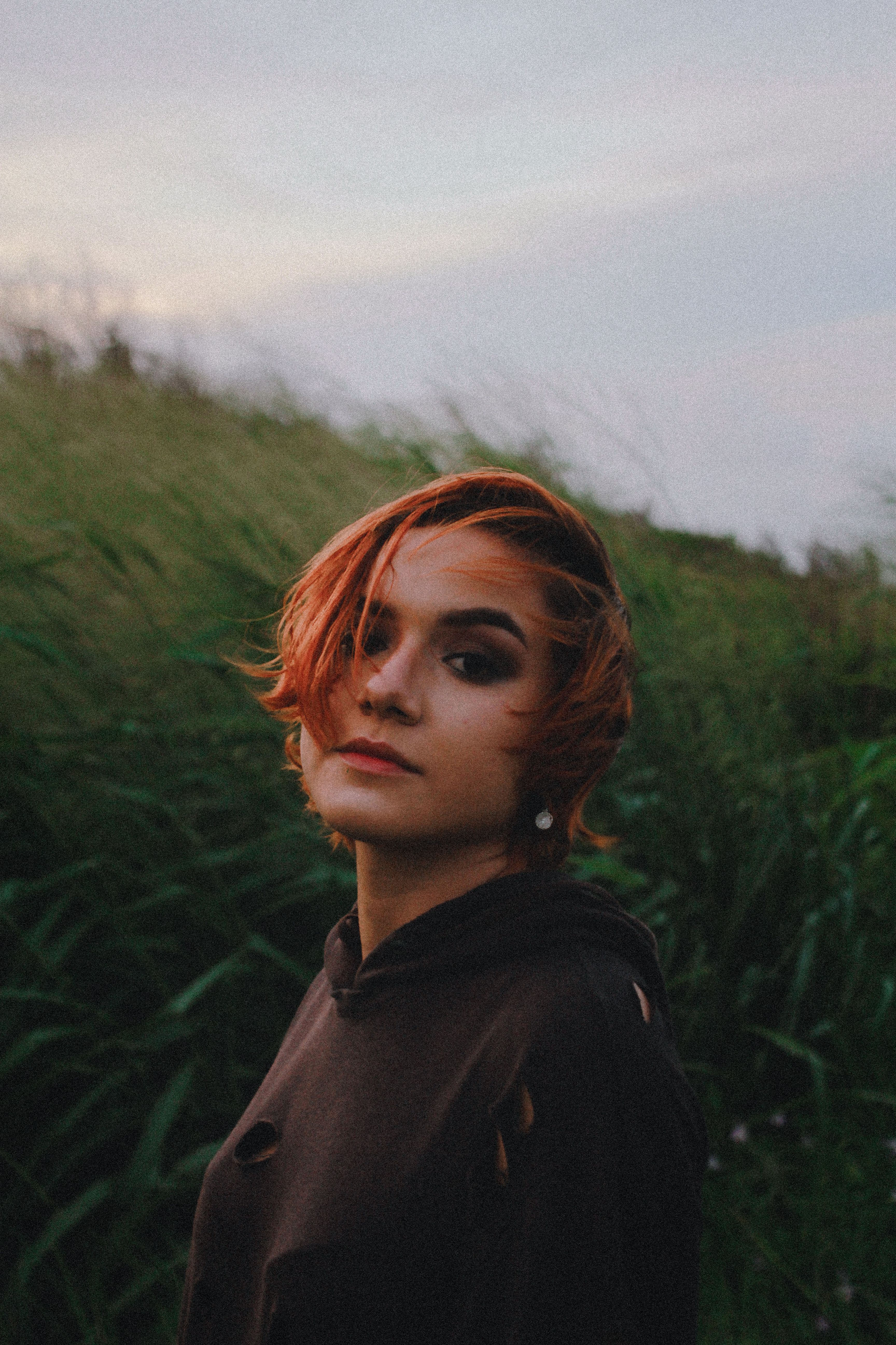 Photo of a Woman with Short Red Hair Looking at the Camera · Free Stock ...