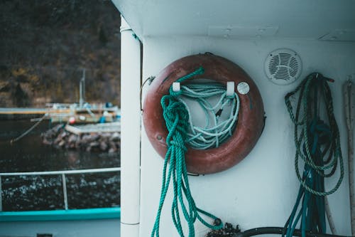 Free Ropes and a Lifebuoy Hanged in a Boat Stock Photo