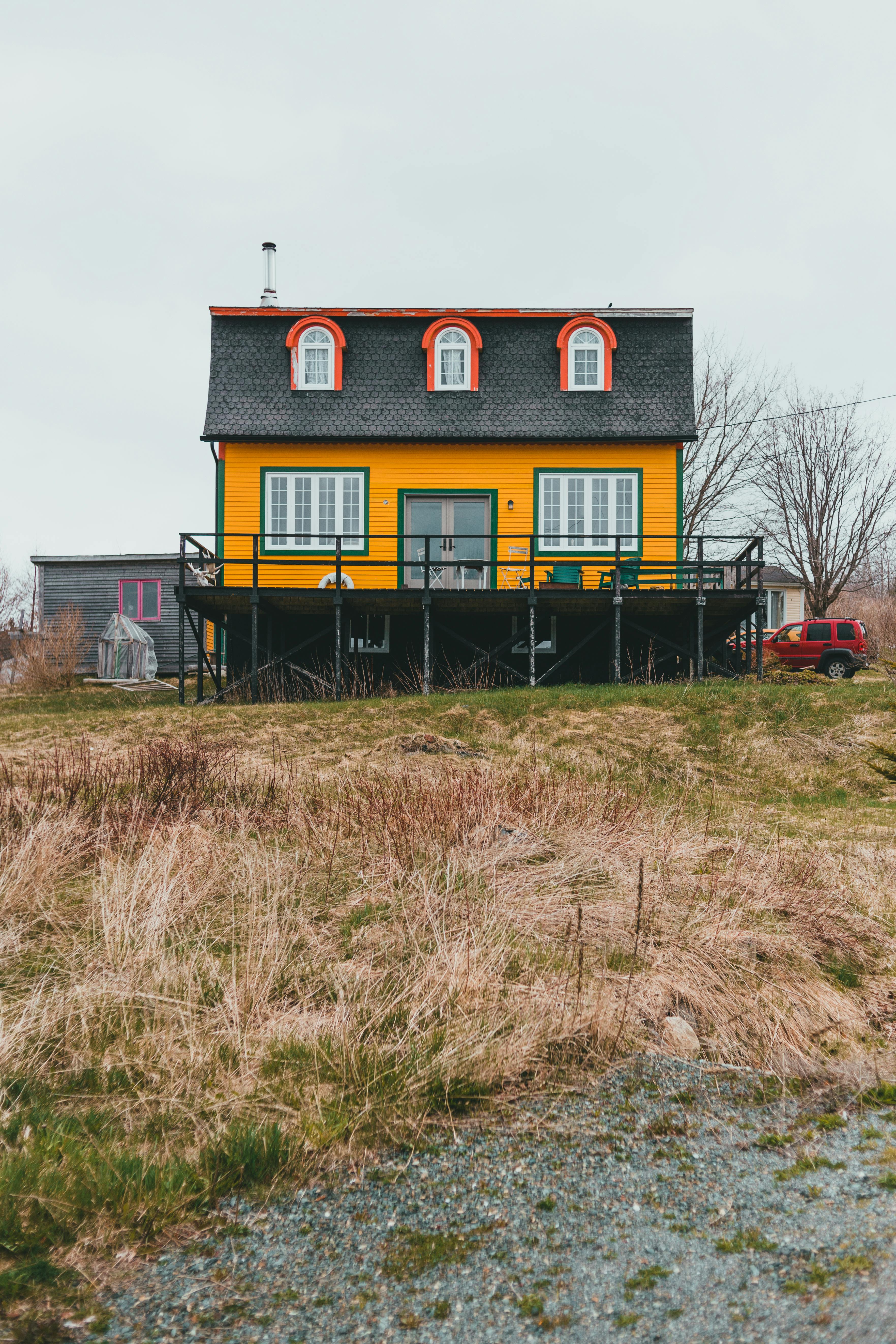 Yellow Painted House On A Grass Land · Free Stock Photo