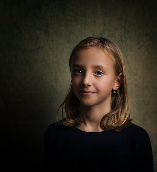 Free Smiling Girl With Blonde Hair Wearing Black Crew-neck Shirt Stock Photo