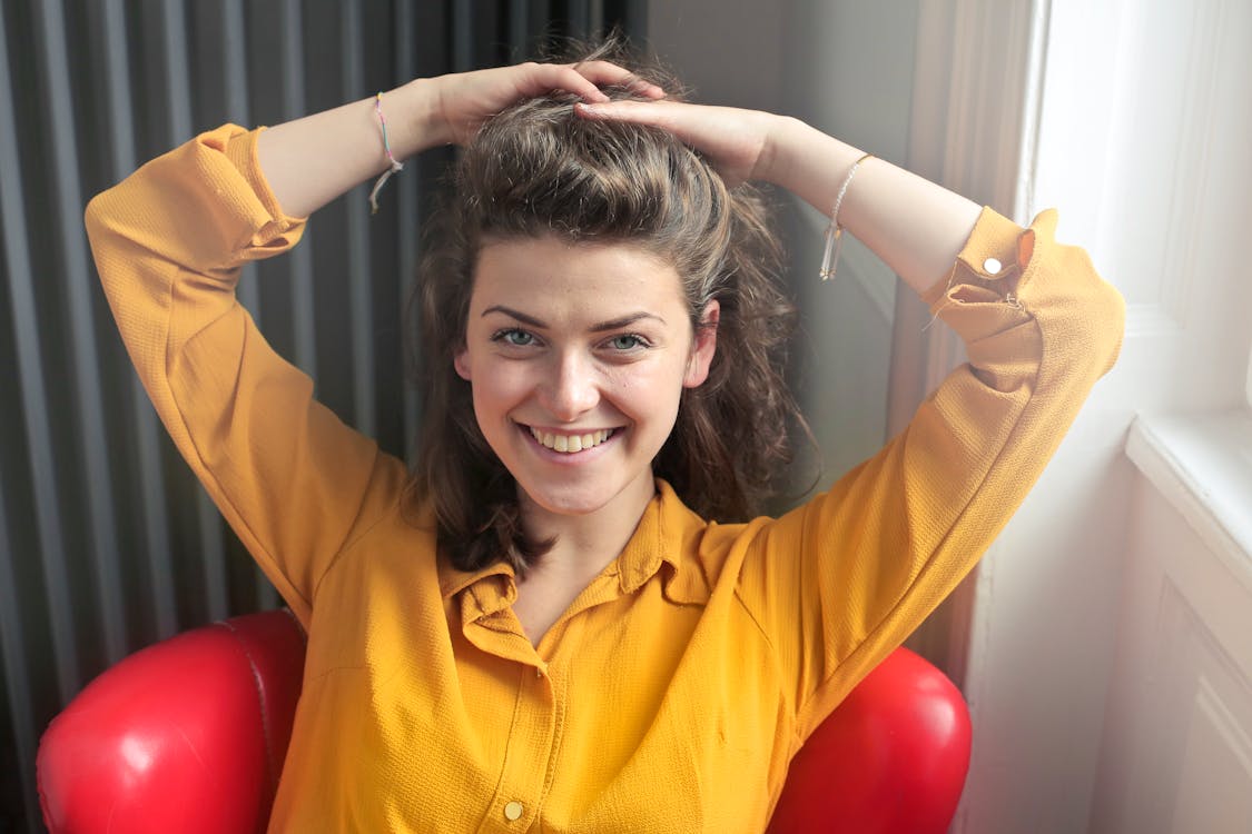 Free Woman Wearing Yellow Button-up Long-sleeved Dress Shirt Stock Photo