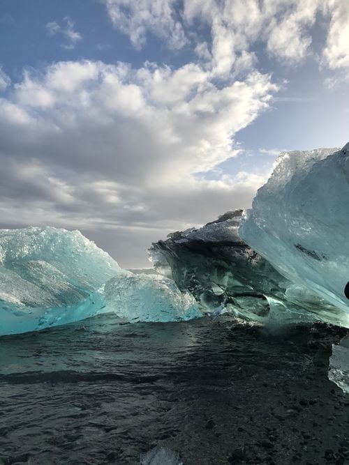 Free Stunning view of icebergs in Iceland's glacial lagoon under a dramatic sky. Stock Photo